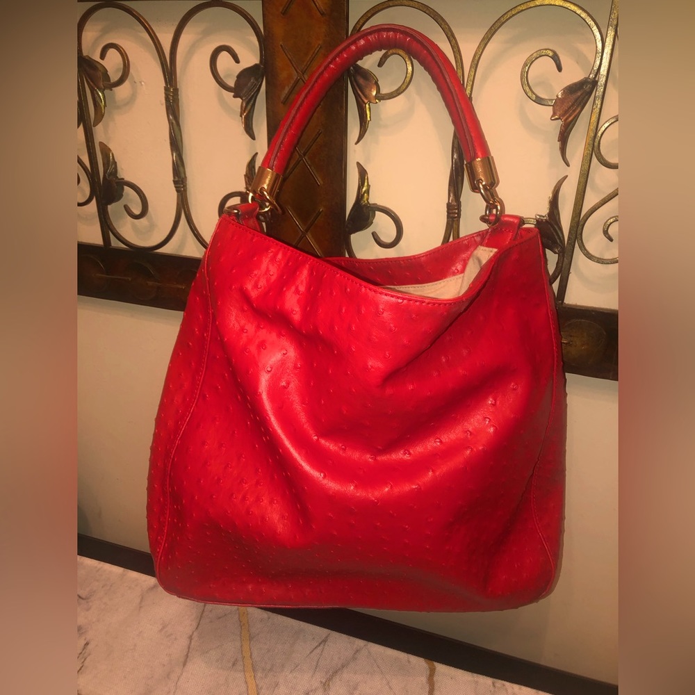 Red faux leather ostrich; light beige inside; cute & very classy